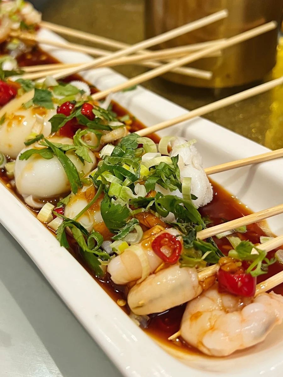 seafood skewers with chilli sauce 114 捞汁海鲜串 12串
